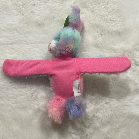 Happy go fluffy plush wrist wrap - Picture 2 of 3